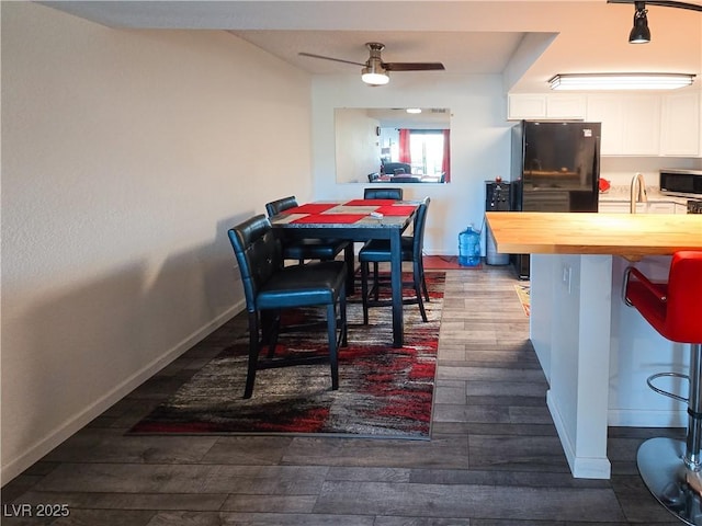 3771 Desert Marina Dr Unit 95, Laughlin, NV 89029 - dining room featuring dark wood-type flooring, a ceiling fan, and baseboards