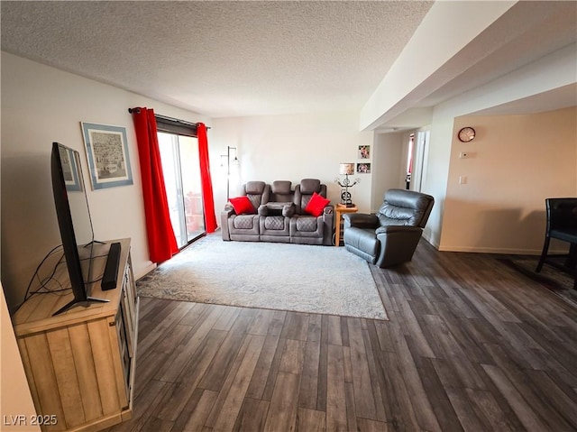 3771 Desert Marina Dr Unit 95, Laughlin, NV 89029 - living room with dark wood-style flooring, a textured ceiling, and baseboards