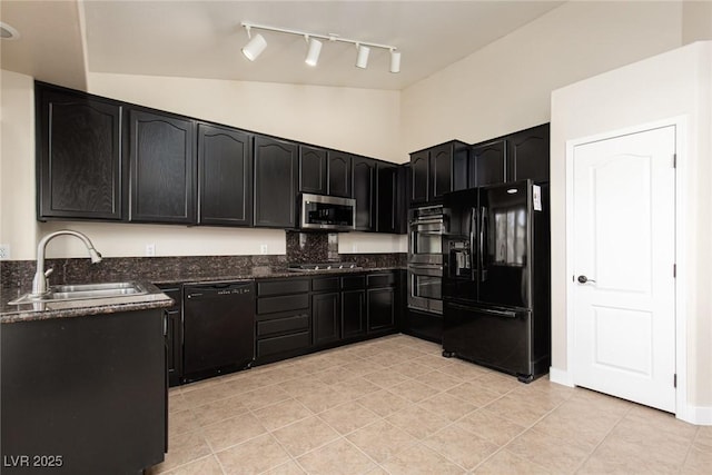 9404 Calico Garden Ave, Las Vegas, NV 89134 - kitchen with black appliances, a sink, rail lighting, dark cabinets, and dark stone counters