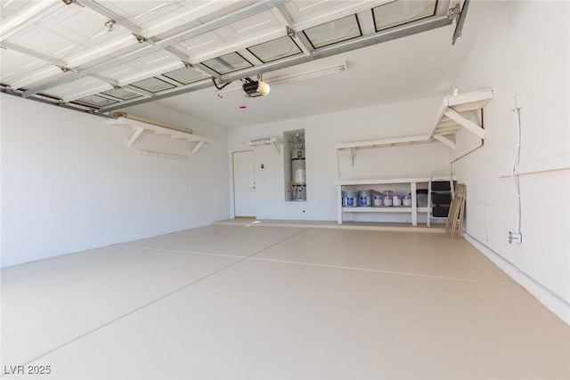 9404 Calico Garden Ave, Las Vegas, NV 89134 - garage featuring secured water heater and a garage door opener