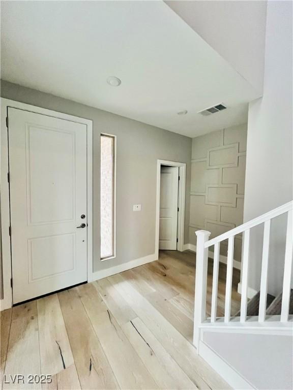 10280 Midnight Meteor Ave, Las Vegas, NV 89166 - foyer entrance featuring light wood-type flooring and baseboards