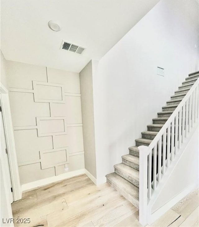 10280 Midnight Meteor Ave, Las Vegas, NV 89166 - stairs featuring wood finished floors and baseboards