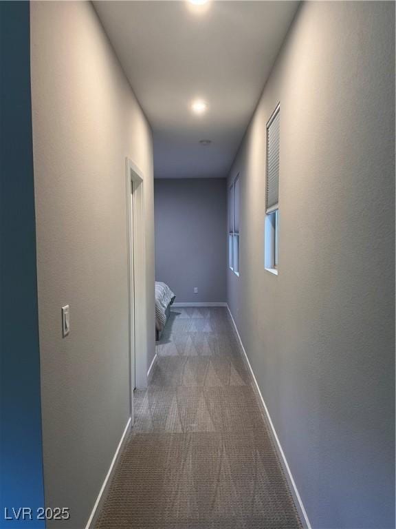 10280 Midnight Meteor Ave, Las Vegas, NV 89166 - hallway featuring carpet floors and baseboards