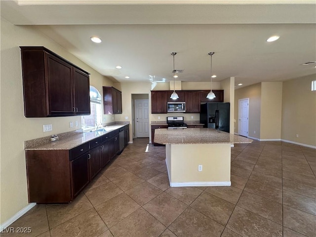 kitchen featuring appliances with stainless steel finishes, dark brown cabinetry, tile patterned floors, and recessed lighting