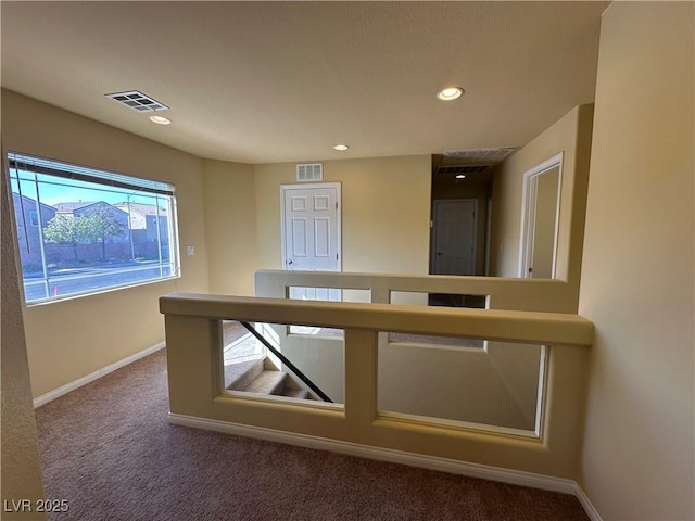 interior space featuring carpet, baseboards, and recessed lighting