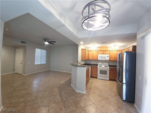4675 Basilicata Ln Unit 103, North Las Vegas, NV 89084 - kitchen with white appliances, light tile patterned floors, a ceiling fan, and a sink