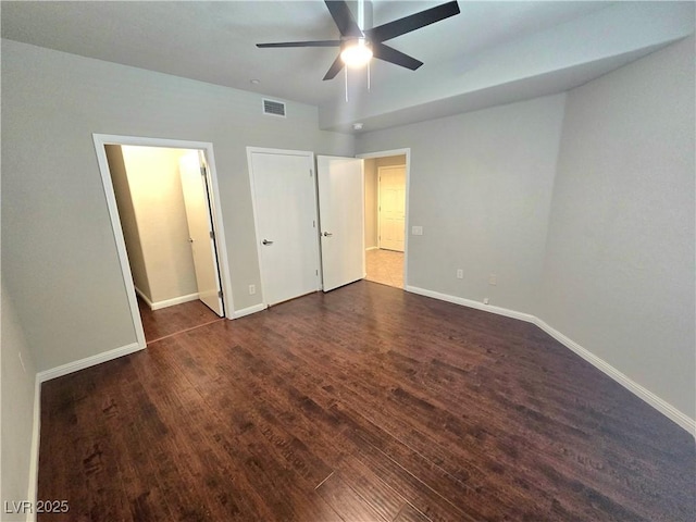 4675 Basilicata Ln Unit 103, North Las Vegas, NV 89084 - unfurnished bedroom featuring wood finished floors, baseboards, and a ceiling fan