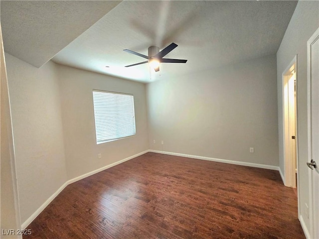 4675 Basilicata Ln Unit 103, North Las Vegas, NV 89084 - empty room with dark wood-style floors, baseboards, a ceiling fan, and a textured ceiling