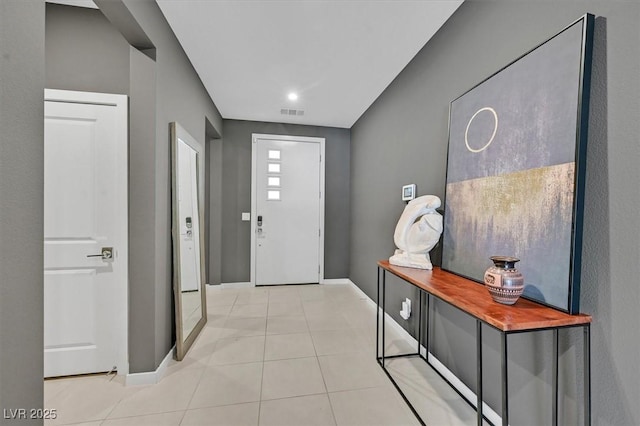6834 Fallen Rock St, North Las Vegas, NV 89084 - entrance foyer with baseboards and light tile patterned floors