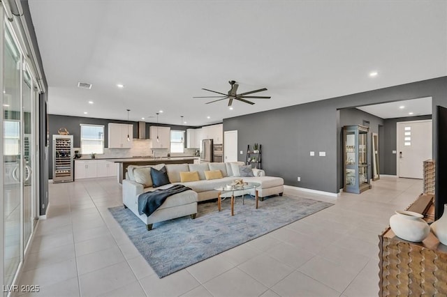 6834 Fallen Rock St, North Las Vegas, NV 89084 - living area featuring ceiling fan, recessed lighting, beverage cooler, light tile patterned flooring, and baseboards