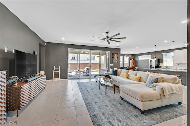 6834 Fallen Rock St, North Las Vegas, NV 89084 - living area with a ceiling fan, light tile patterned floors, recessed lighting, and baseboards