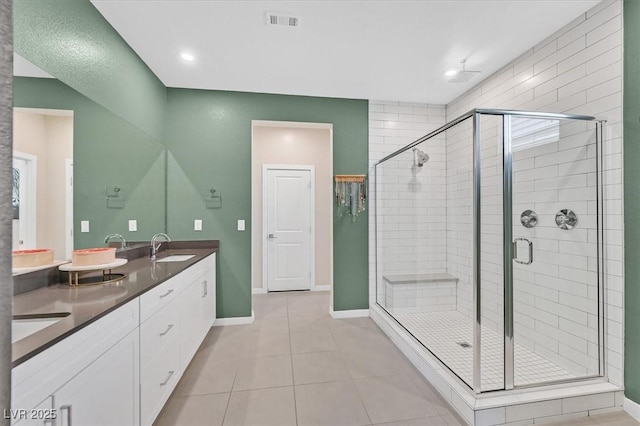 6834 Fallen Rock St, North Las Vegas, NV 89084 - full bathroom featuring double vanity, a stall shower, tile patterned floors, baseboards, and recessed lighting