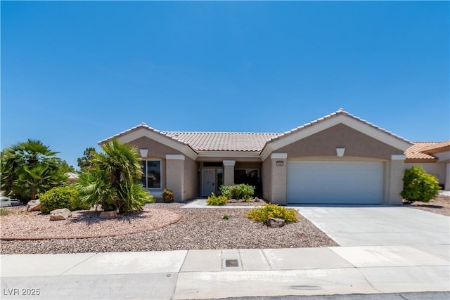 10301 Coal Creek Pl, Las Vegas, NV 89134 - ranch-style home featuring a tile roof, a garage, stucco siding, and concrete driveway