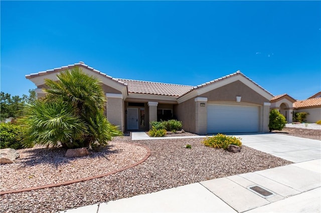 10301 Coal Creek Pl, Las Vegas, NV 89134 - single story home with an attached garage, concrete driveway, a tile roof, and stucco siding