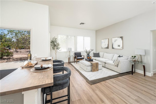 10301 Coal Creek Pl, Las Vegas, NV 89134 - living room featuring plenty of natural light and light wood-style floors