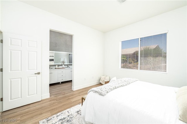 10301 Coal Creek Pl, Las Vegas, NV 89134 - bedroom featuring light wood-type flooring and baseboards