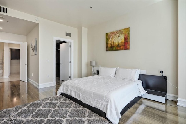 2700 S Las Vegas Blvd Unit 4305, Las Vegas, NV 89109 - bedroom featuring wood finished floors, baseboards, a spacious closet, and recessed lighting
