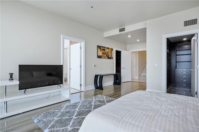 2700 S Las Vegas Blvd Unit 4305, Las Vegas, NV 89109 - bedroom featuring wood finished floors, baseboards, a walk in closet, and recessed lighting