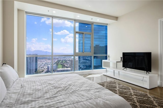 2700 S Las Vegas Blvd Unit 4305, Las Vegas, NV 89109 - bedroom featuring expansive windows and wood finished floors