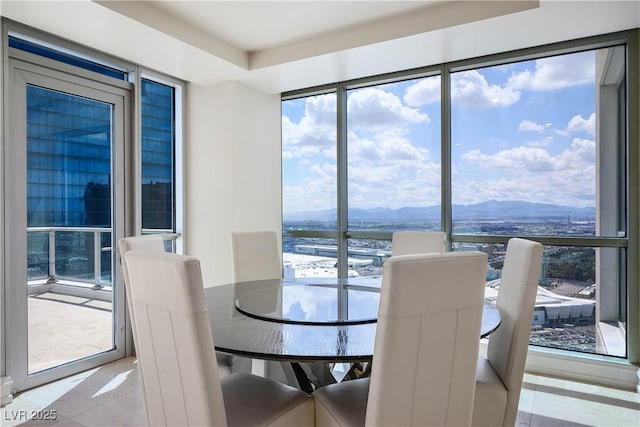 2700 S Las Vegas Blvd Unit 4305, Las Vegas, NV 89109 - tiled dining room featuring a mountain view and plenty of natural light