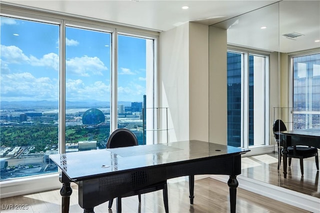2700 S Las Vegas Blvd Unit 4305, Las Vegas, NV 89109 - dining space with a city view, wood finished floors, expansive windows, and recessed lighting