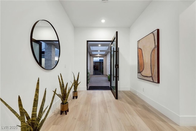11895 Skyline Arch Ct, Las Vegas, NV 89138 - hallway featuring recessed lighting, light wood-type flooring, and baseboards