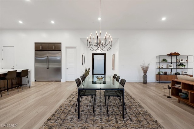 11895 Skyline Arch Ct, Las Vegas, NV 89138 - dining space featuring light wood finished floors, a chandelier, recessed lighting, and baseboards
