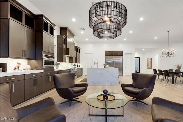 11895 Skyline Arch Ct, Las Vegas, NV 89138 - living area with a chandelier, light wood-type flooring, and recessed lighting
