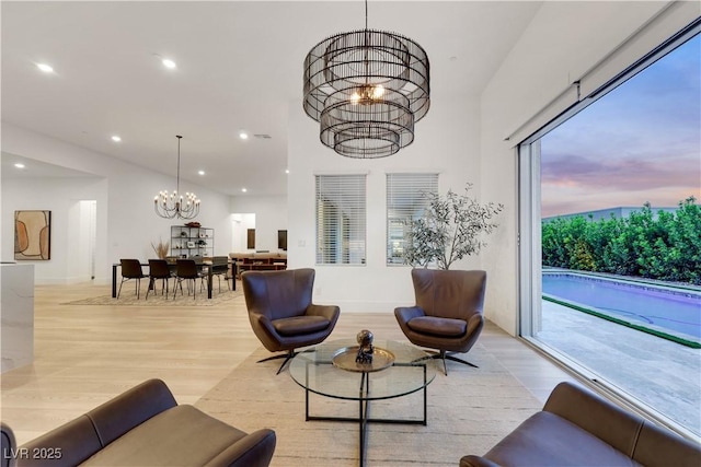 11895 Skyline Arch Ct, Las Vegas, NV 89138 - living area featuring a chandelier, light wood-type flooring, and recessed lighting