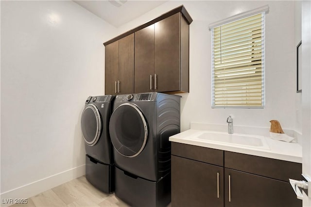 11895 Skyline Arch Ct, Las Vegas, NV 89138 - washroom featuring cabinet space, separate washer and dryer, and baseboards