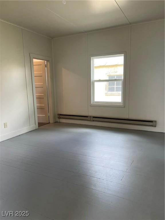 4 Keystone St, Ruth, NV 89319 - spare room featuring a baseboard heating unit, hardwood / wood-style flooring, and baseboards