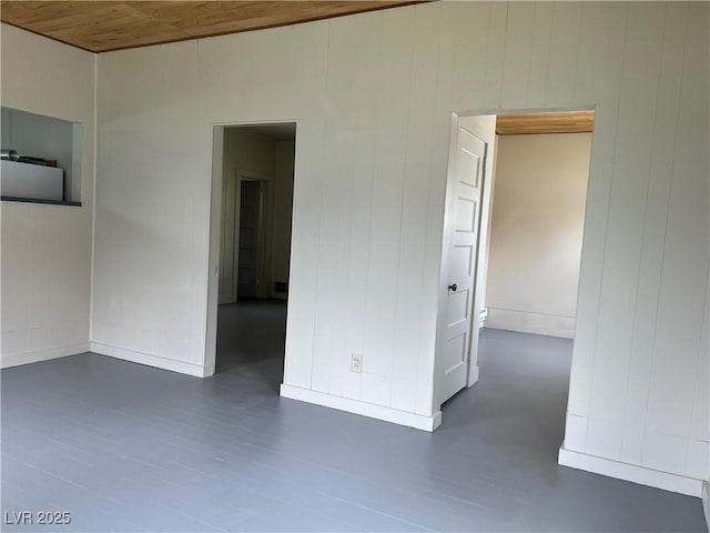4 Keystone St, Ruth, NV 89319 - empty room with baseboards, dark wood-style floors, and wood walls