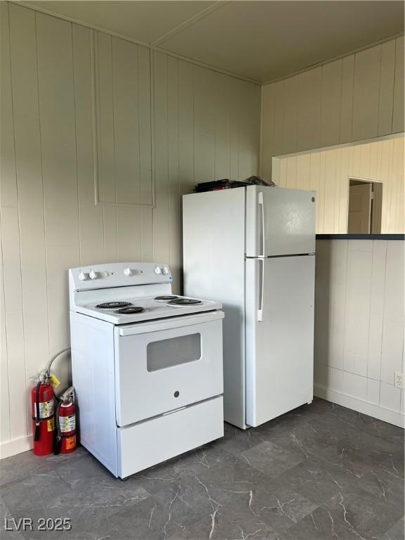 4 Keystone St, Ruth, NV 89319 - kitchen with white appliances and wooden walls