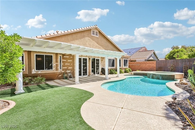 view of swimming pool featuring a pergola, a pool with connected hot tub, and a patio