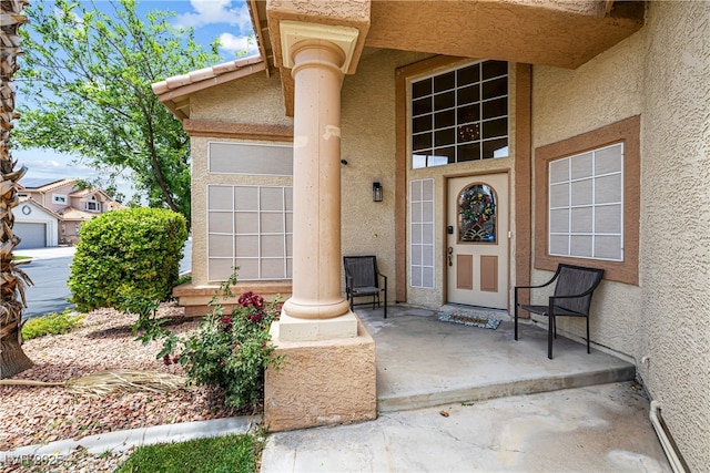 5449 Desert Spring Rd, Las Vegas, NV 89149 - view of exterior entry with stucco siding and covered porch