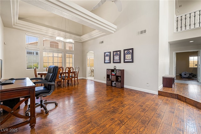 5449 Desert Spring Rd, Las Vegas, NV 89149 - office space with arched walkways, a towering ceiling, hardwood / wood-style flooring, baseboards, and ceiling fan