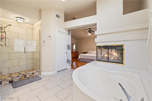 5449 Desert Spring Rd, Las Vegas, NV 89149 - full bath with a ceiling fan, ensuite bath, a garden tub, a shower stall, and a tile fireplace