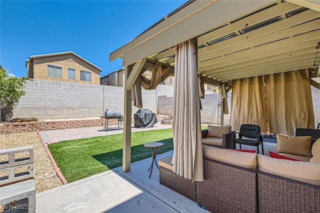 view of patio with a fenced backyard, an outdoor hangout area, and area for grilling