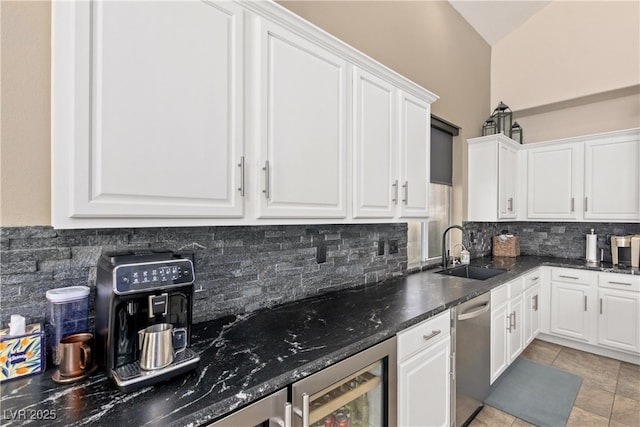 kitchen featuring wine cooler, a sink, dishwasher, backsplash, and white cabinetry