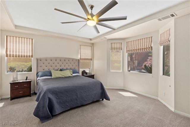 carpeted bedroom with baseboards and ceiling fan