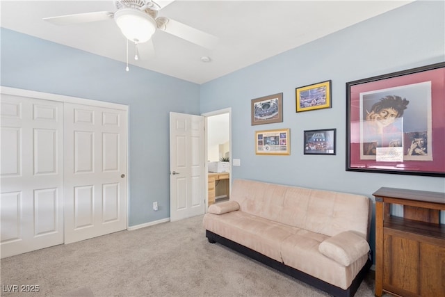 living area with carpet floors, a ceiling fan, and baseboards