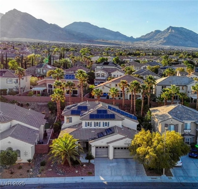 aerial view of residential area with mountains