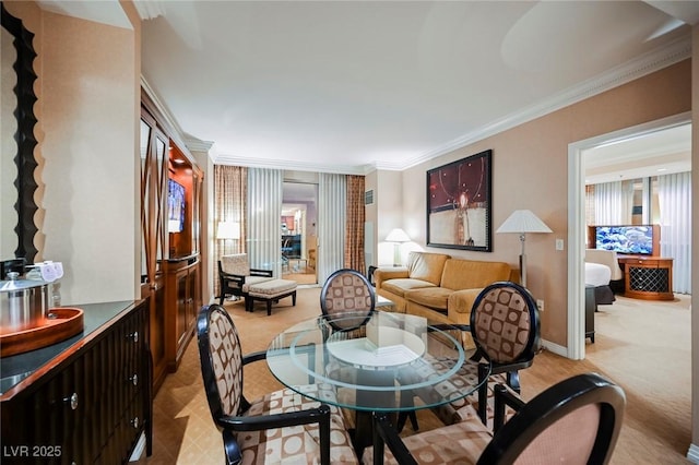135 Harmon Ave Unit 3220, Las Vegas, NV 89109 - dining space featuring crown molding, light colored carpet, and baseboards
