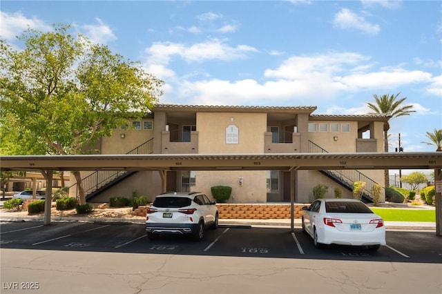 4400 S Jones Blvd Unit 2033, Las Vegas, NV 89103 - view of property with stairway and covered parking