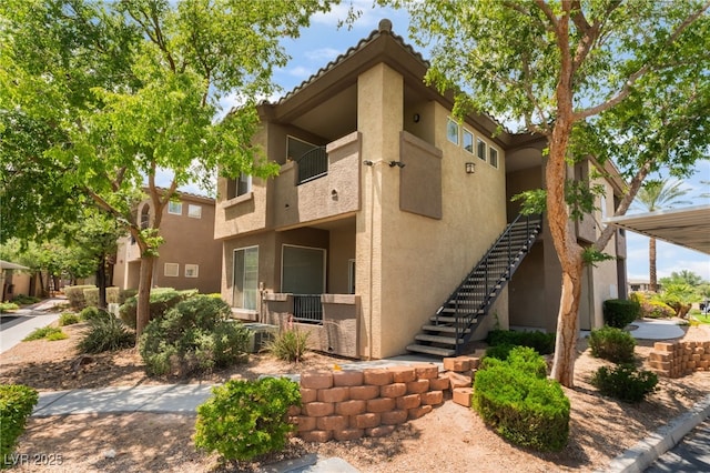 4400 S Jones Blvd Unit 2033, Las Vegas, NV 89103 - view of building exterior featuring stairway