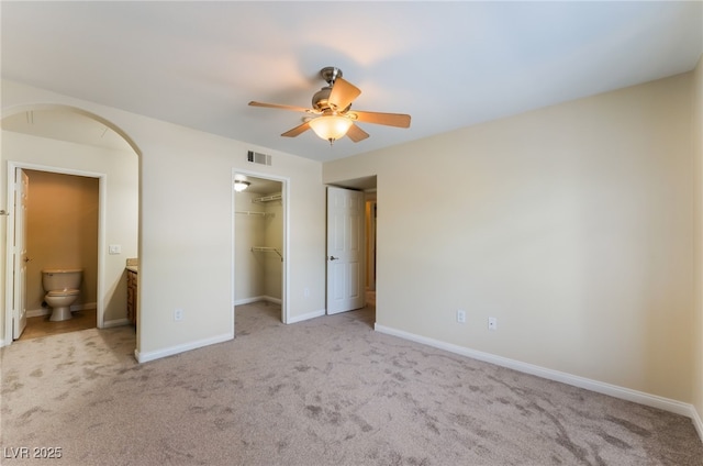 4400 S Jones Blvd Unit 2033, Las Vegas, NV 89103 - unfurnished bedroom featuring carpet flooring, connected bathroom, a spacious closet, and a closet