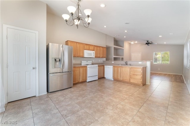 kitchen featuring white appliances, vaulted ceiling, light countertops, a chandelier, and baseboards
