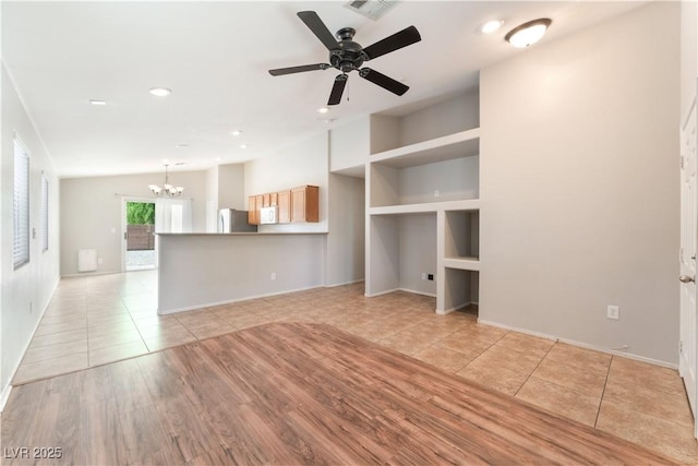 unfurnished living room with a chandelier, light tile patterned flooring, recessed lighting, baseboards, and a ceiling fan