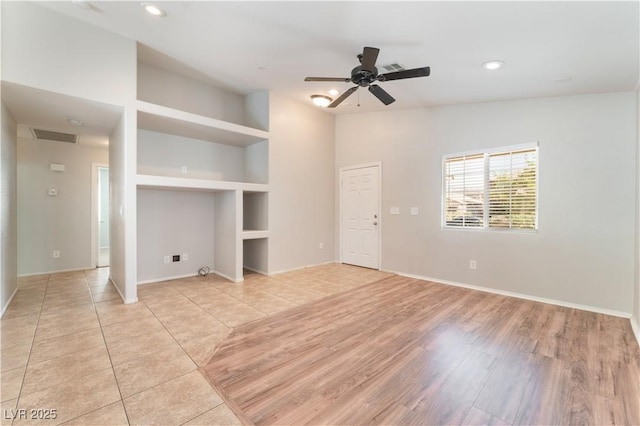 unfurnished living room with a ceiling fan, recessed lighting, light wood-style flooring, and baseboards