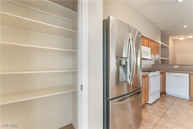kitchen with white appliances, light tile patterned floors, recessed lighting, light countertops, and open shelves